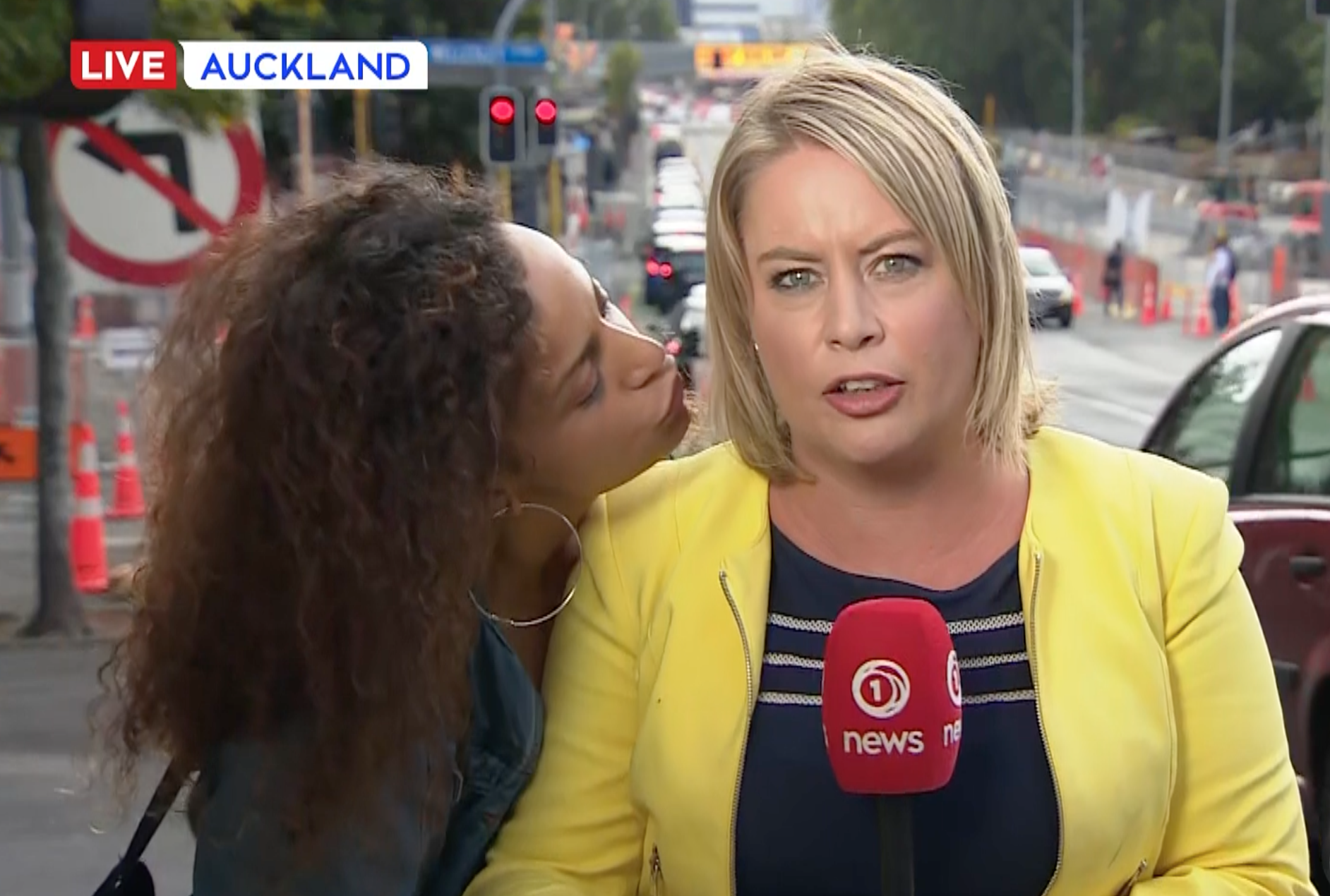 Random lady tries to kiss 1 News reporter during live cross
