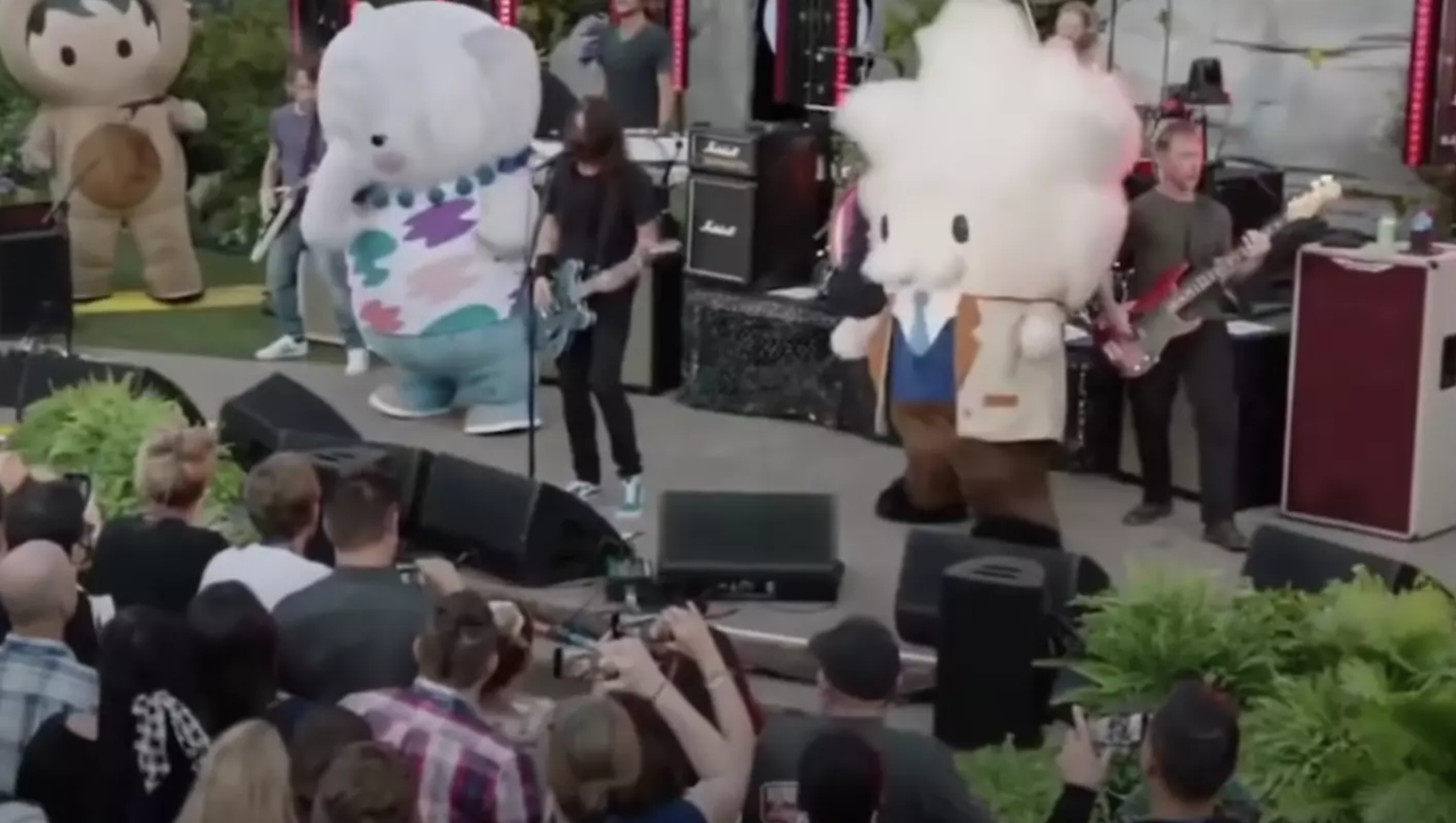 Watch Foo Fighters rock out with costumed mascots at private show