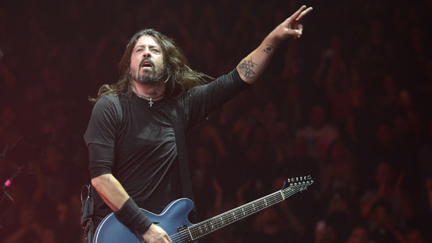 Watch Dave Grohl deal with an Aussie fan who crashes the stage