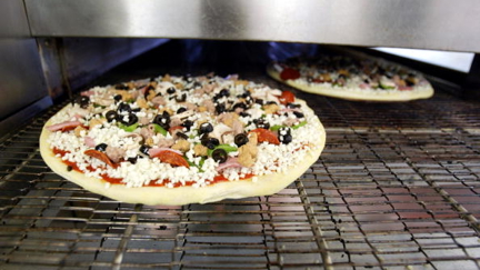 Domino's delivery man fired after eating toppings off a customer's pizza