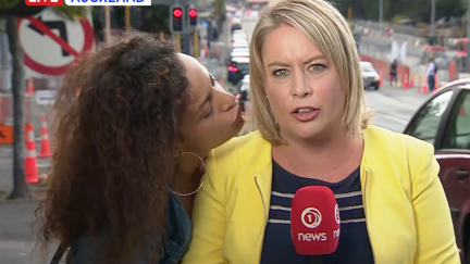 Random lady tries to kiss 1 News reporter during live cross