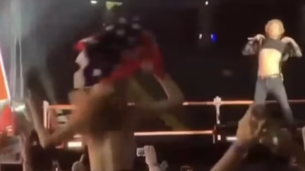 WATCH: Mick Jagger Lifts Up His Top In Response To A Topless Women In Audience