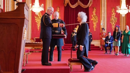 Brian May knighted by King Charles at Buckingham Palace