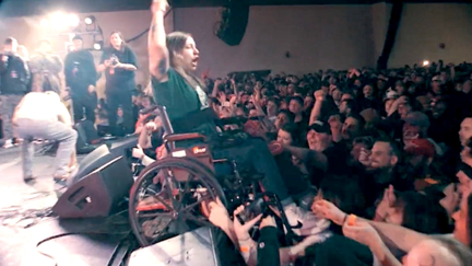 WATCH: Concertgoer in Wheelchair Crowd-Surfs and Stage-Dives